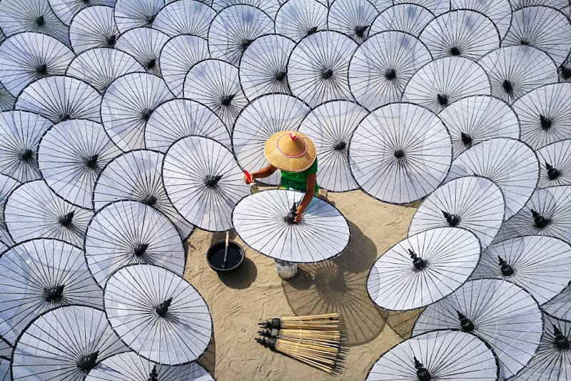 Among the white umbrellas